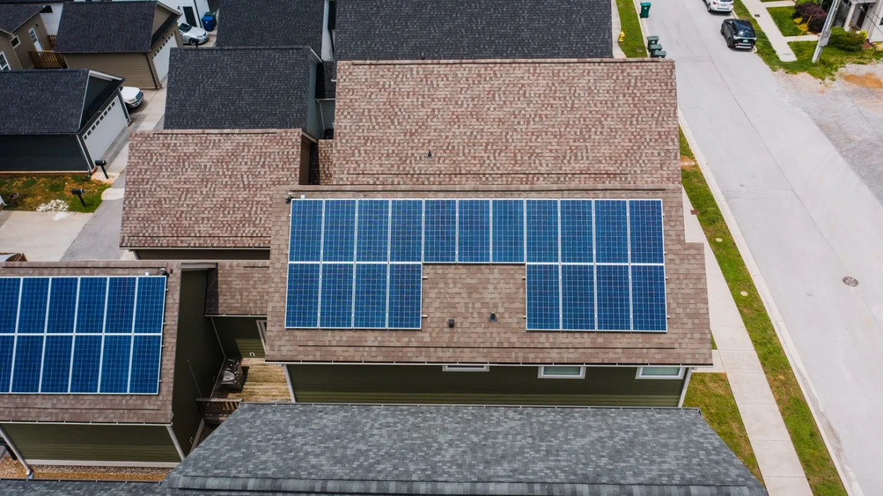 Aerial photograph of solar panels on residential rooftops